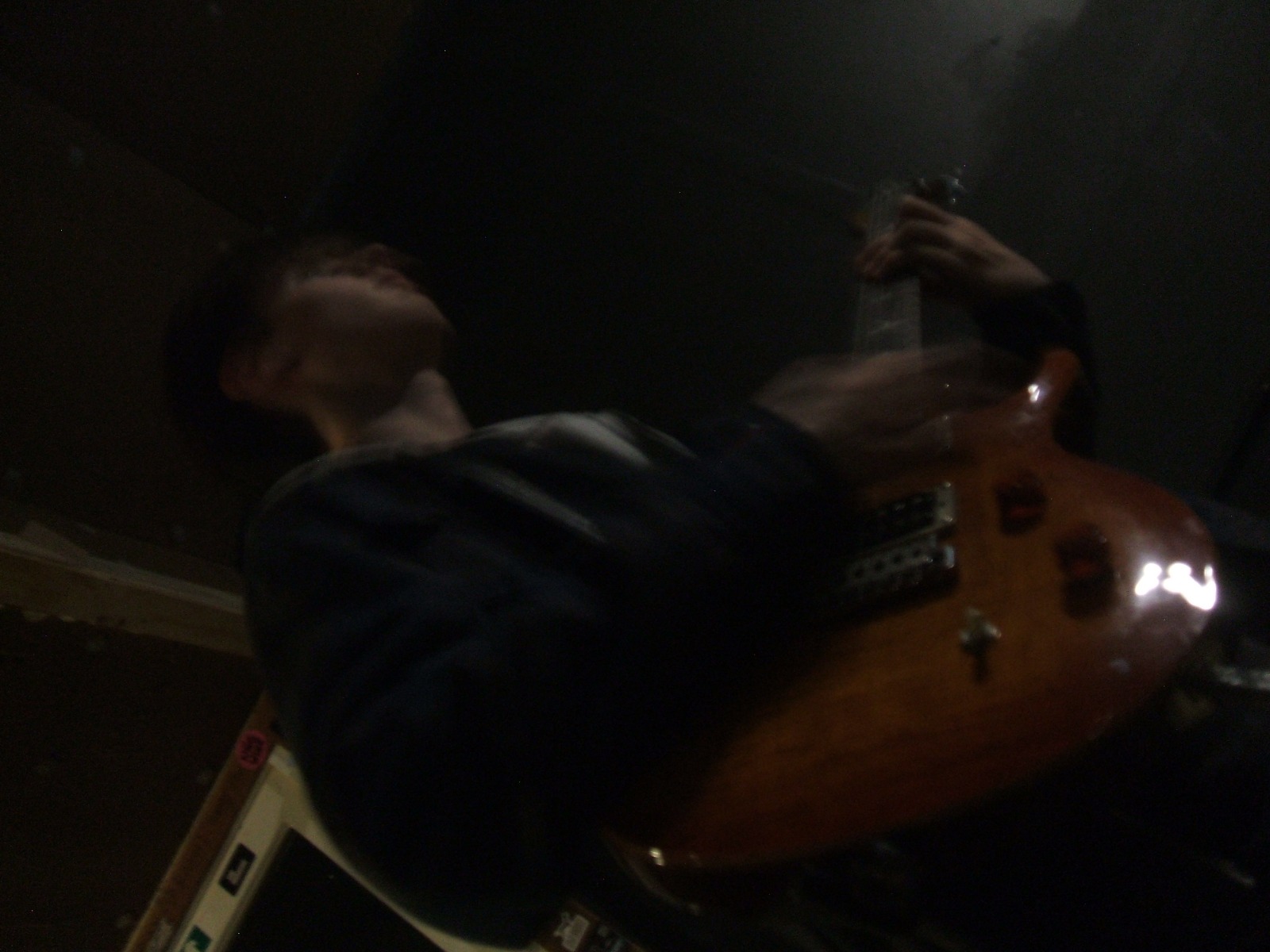 Band member playing guitar