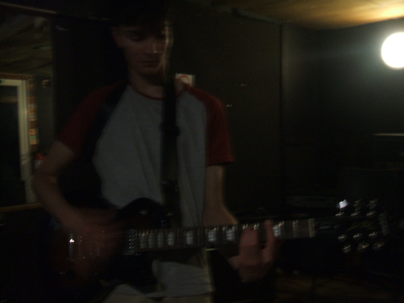 Band member performing with a guitar