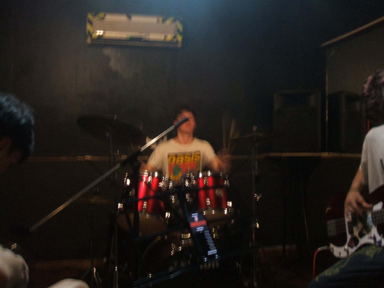 Musician playing guitar at rehearsal