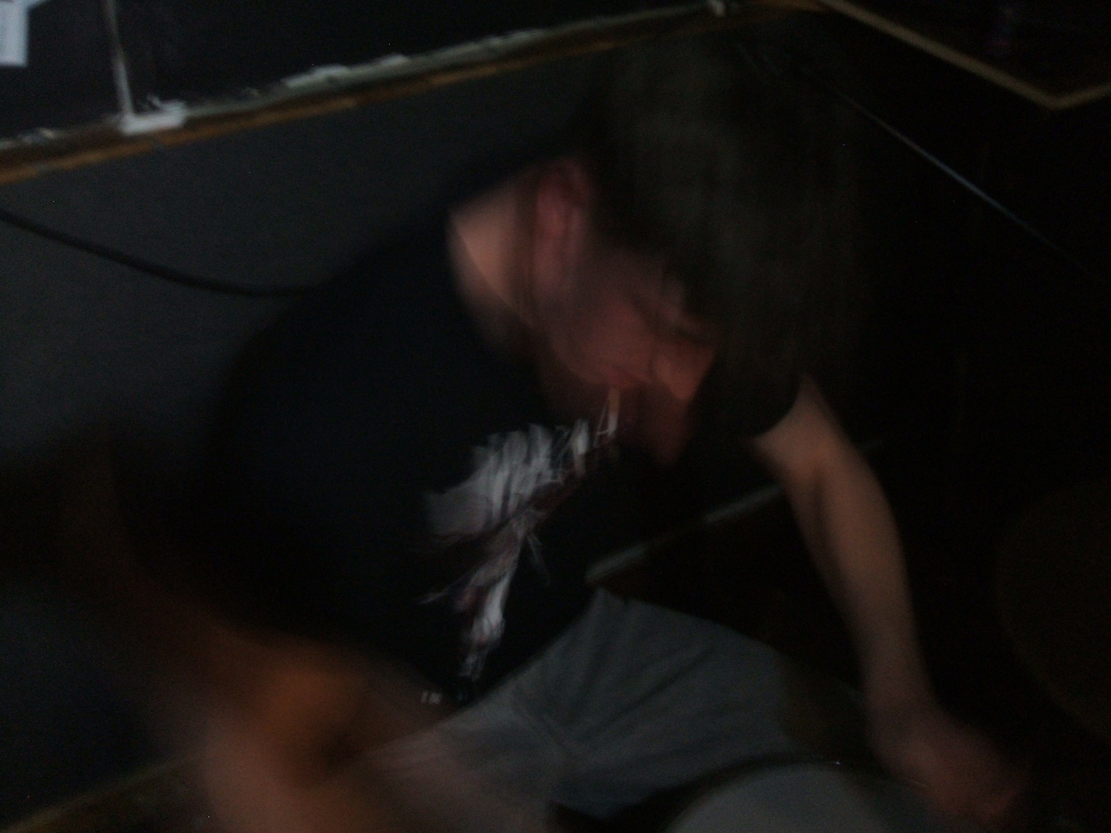 Band member performing beside a microphone