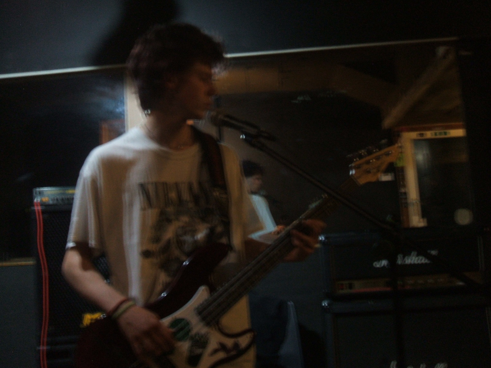 Guitarist playing in a dimly lit room