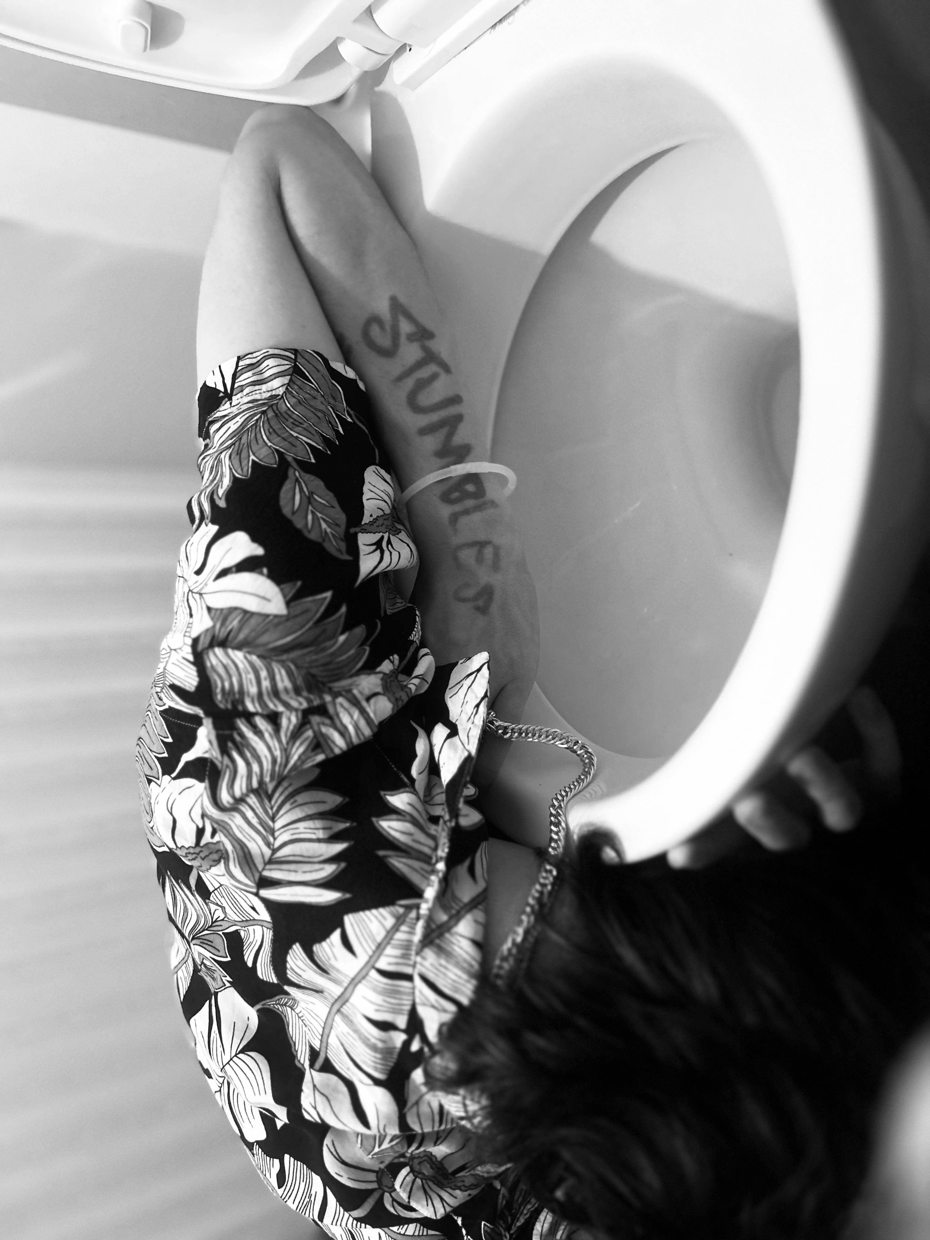 Band member in a humorous bathroom photo